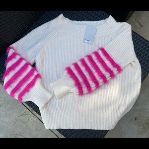 White sweater with hot pink stripes on sleeves